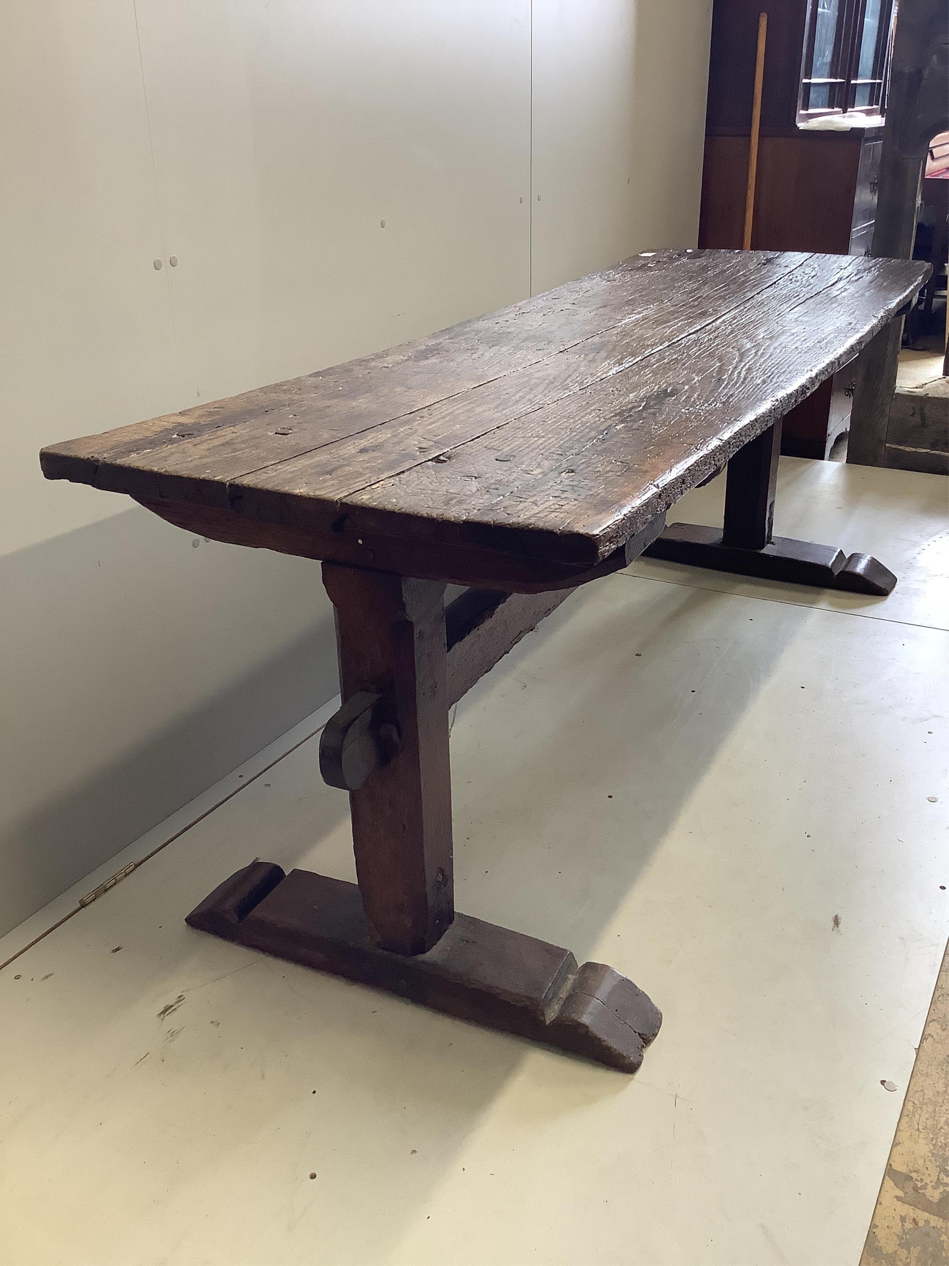 A 17th century elm topped oak refectory table, width 199cm, depth 69cm, height 75cm. Condition - poor-fair